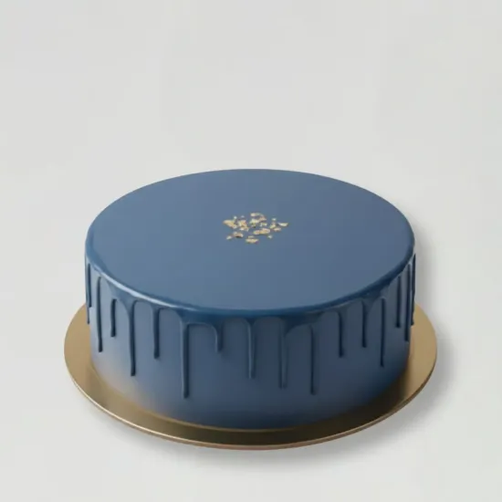 Monochrome Drip Cake by Blue Heaven Deep blue monochrome drip cake with gold detailing by Blue Heaven