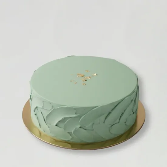 Textured Whipped Cream Cake by Blue Heaven Pastel green textured whipped cream cake with gold detailing by Blue Heaven