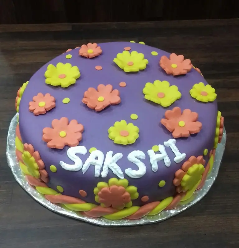 Colorful floral fondant birthday cake with purple and yellow flowers by Blue Heaven, online cake delivery in Bhopal